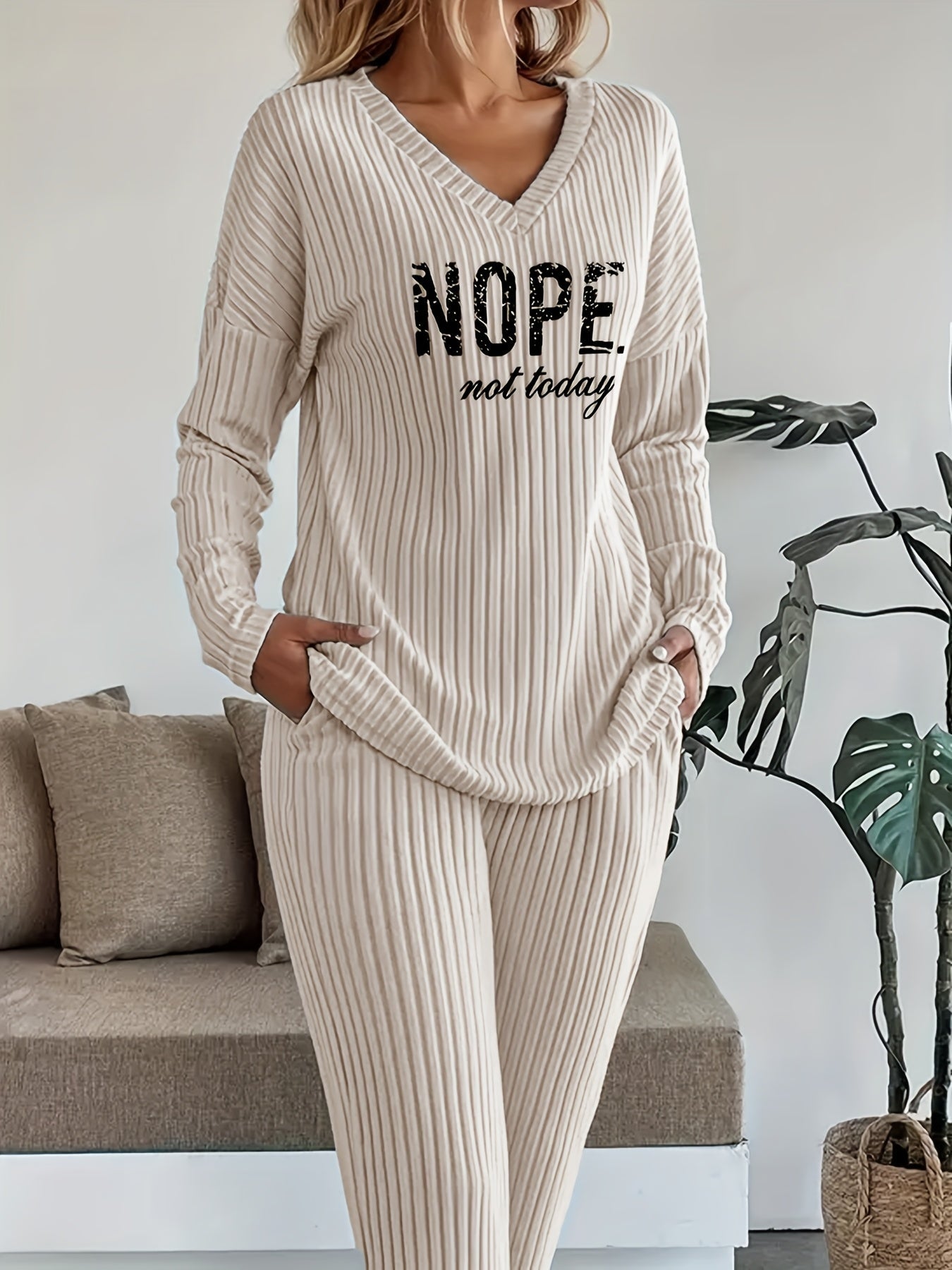 Ribbed women’s two-piece set with a V-neck top featuring lettering and wide-leg pants