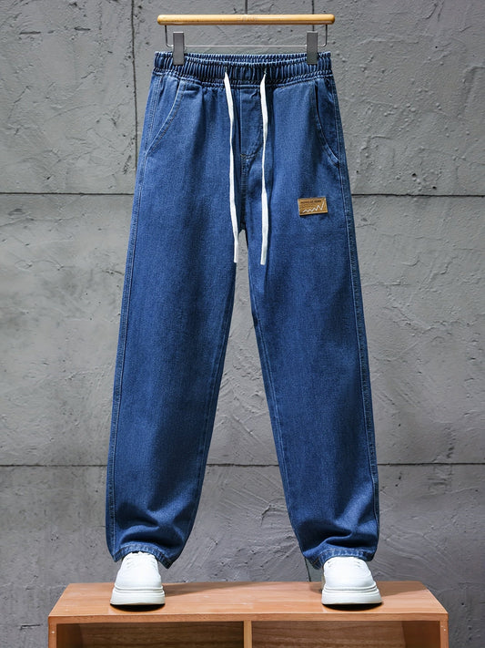 Dark blue jeans with an elastic waistband and drawstring