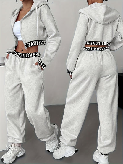 Women's two-piece tracksuit with a hooded jacket and cropped-length joggers featuring a “LOVE” waistband