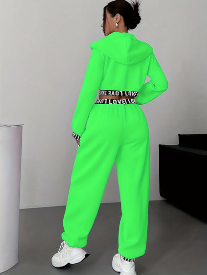Women's two-piece tracksuit with a hooded jacket and cropped-length joggers featuring a “LOVE” waistband