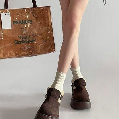 Brown platform moccasins with fur lining and buckle