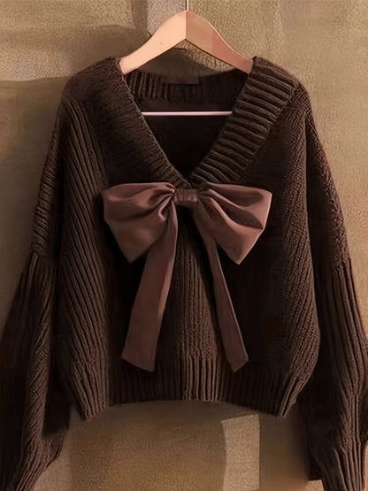 Women's ribbed long-sleeve V-neck sweater with a large bow