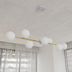 Hanglamp gepoedercoat staal en glas Gravity, wit en goud, 140 cm breed, 8 fittingen E14, verstelbare hoogte
