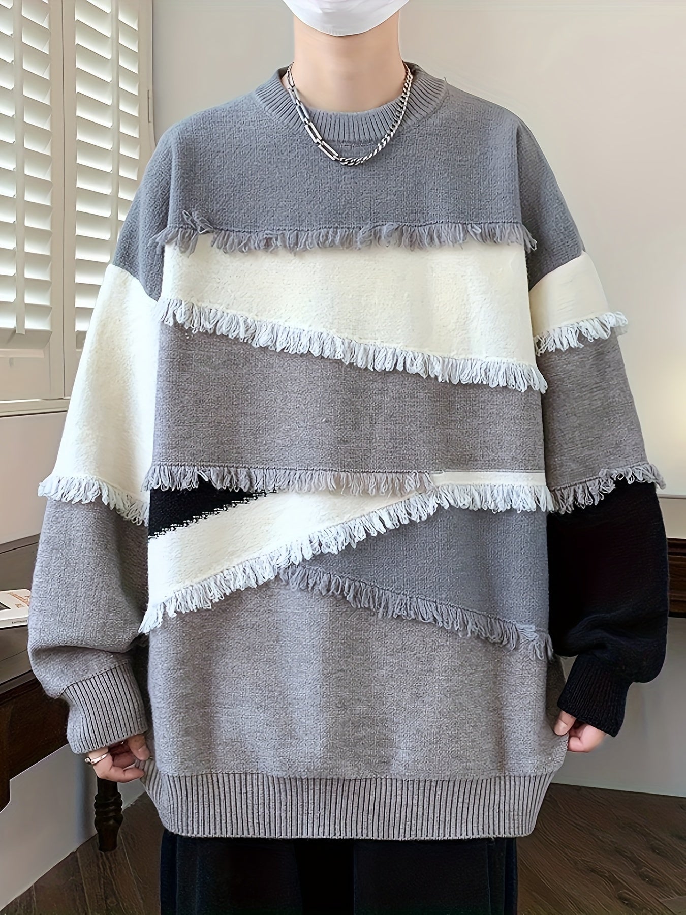 Unisex long-sleeve pullover with color-block design, fringe, and crew neck