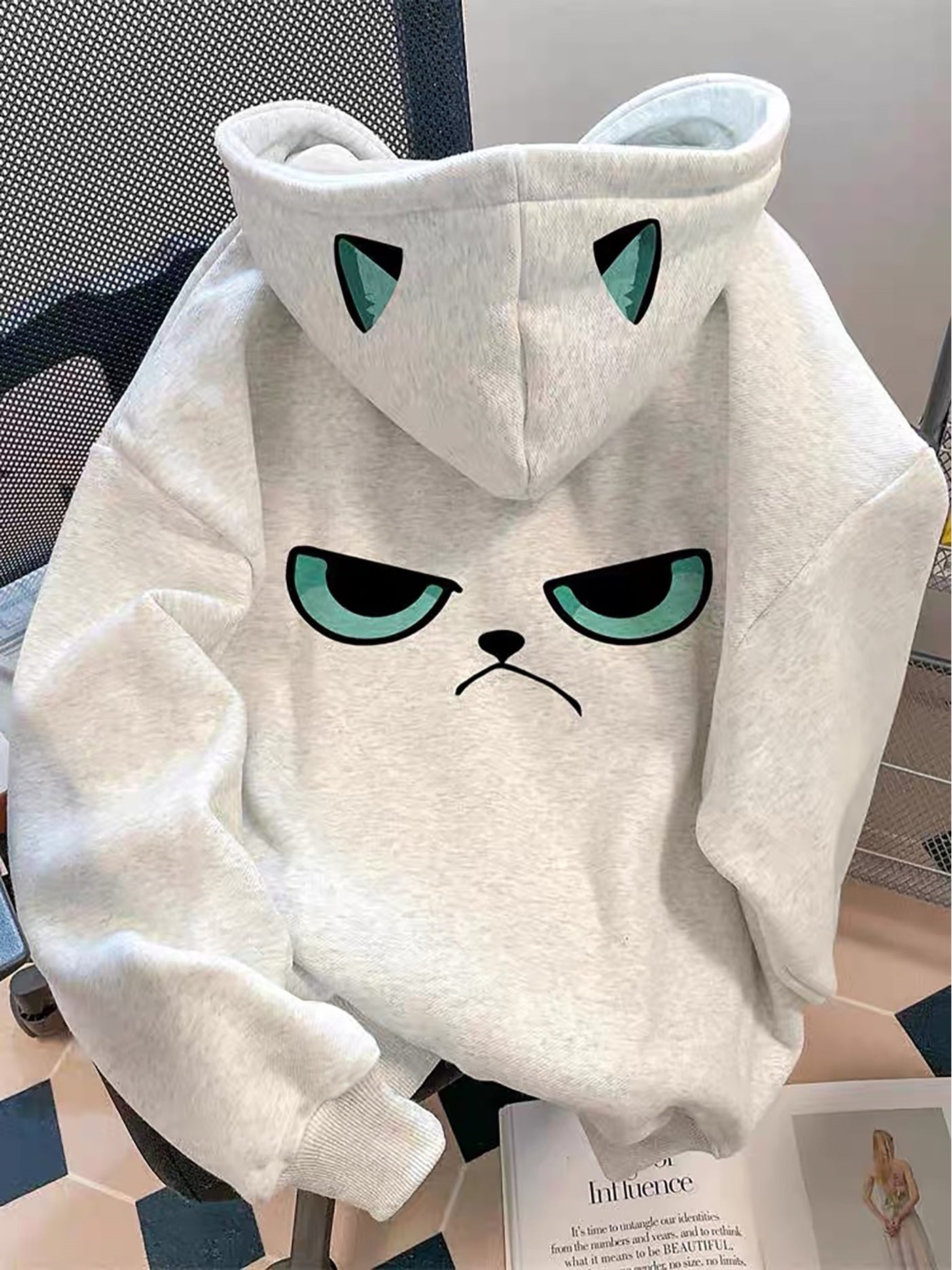 Light gray hoodie with cat print and ears on the hood