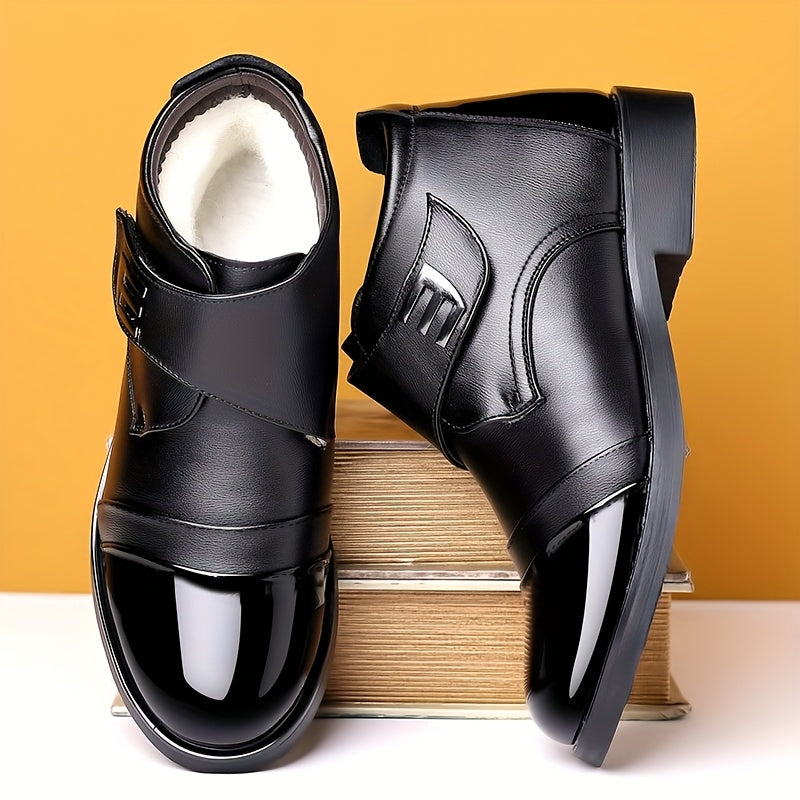 Black men’s slip-on ankle boots with a polished toe cap and Velcro fastening