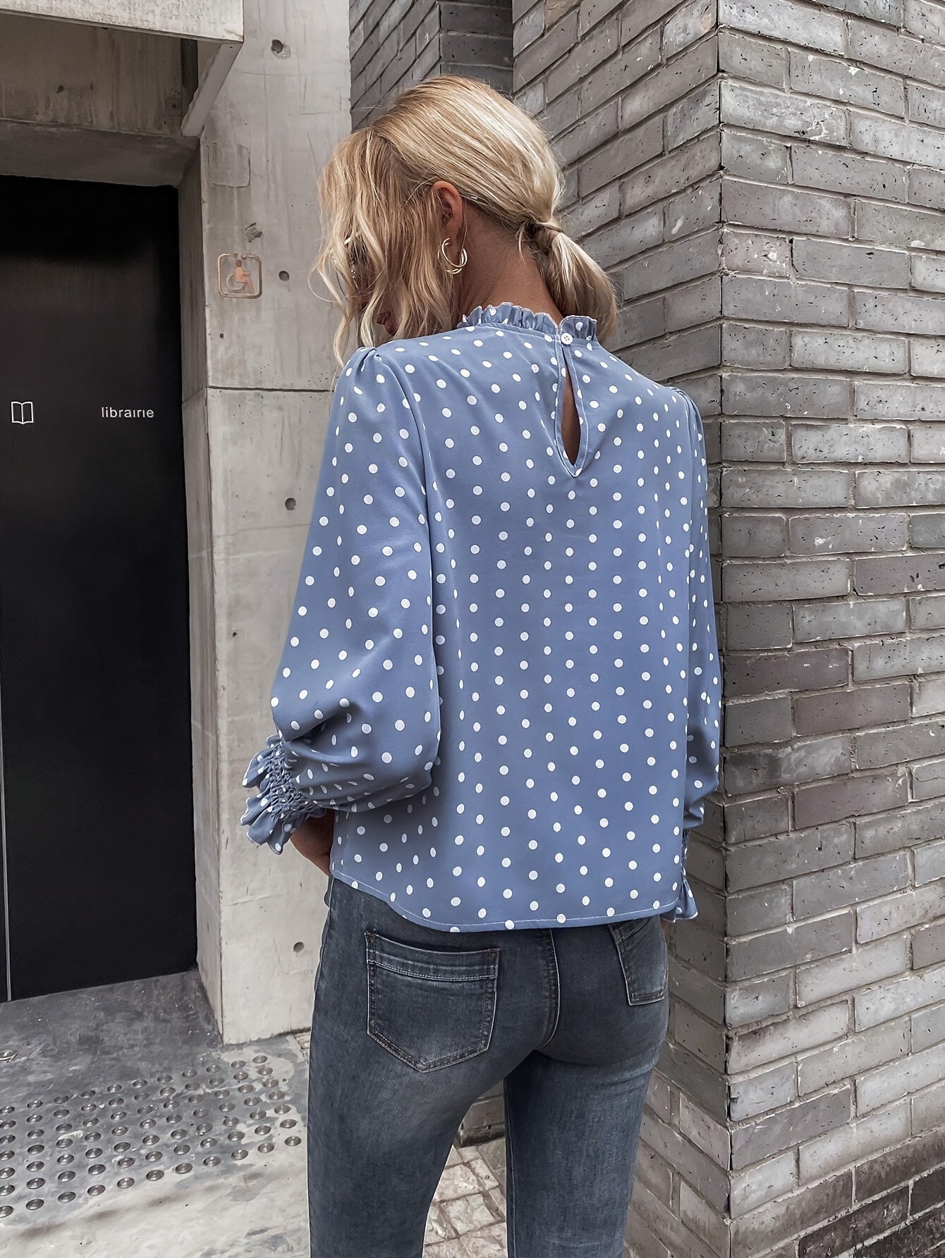 Women's blouse with polka-dot pattern, stand-up collar, and gathered sleeves