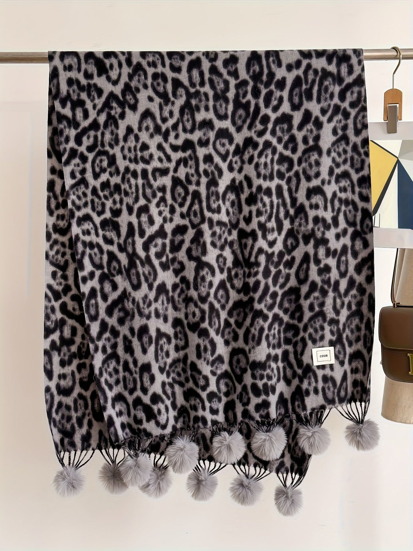 Leopard-print scarf with pom-poms