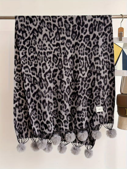 Leopard-print scarf with pom-poms