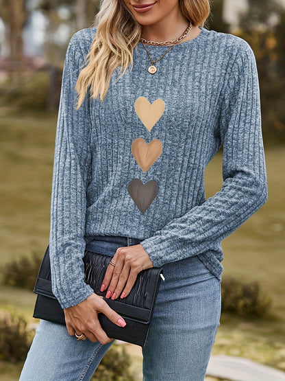 Women's black long-sleeve shirt with heart appliqués