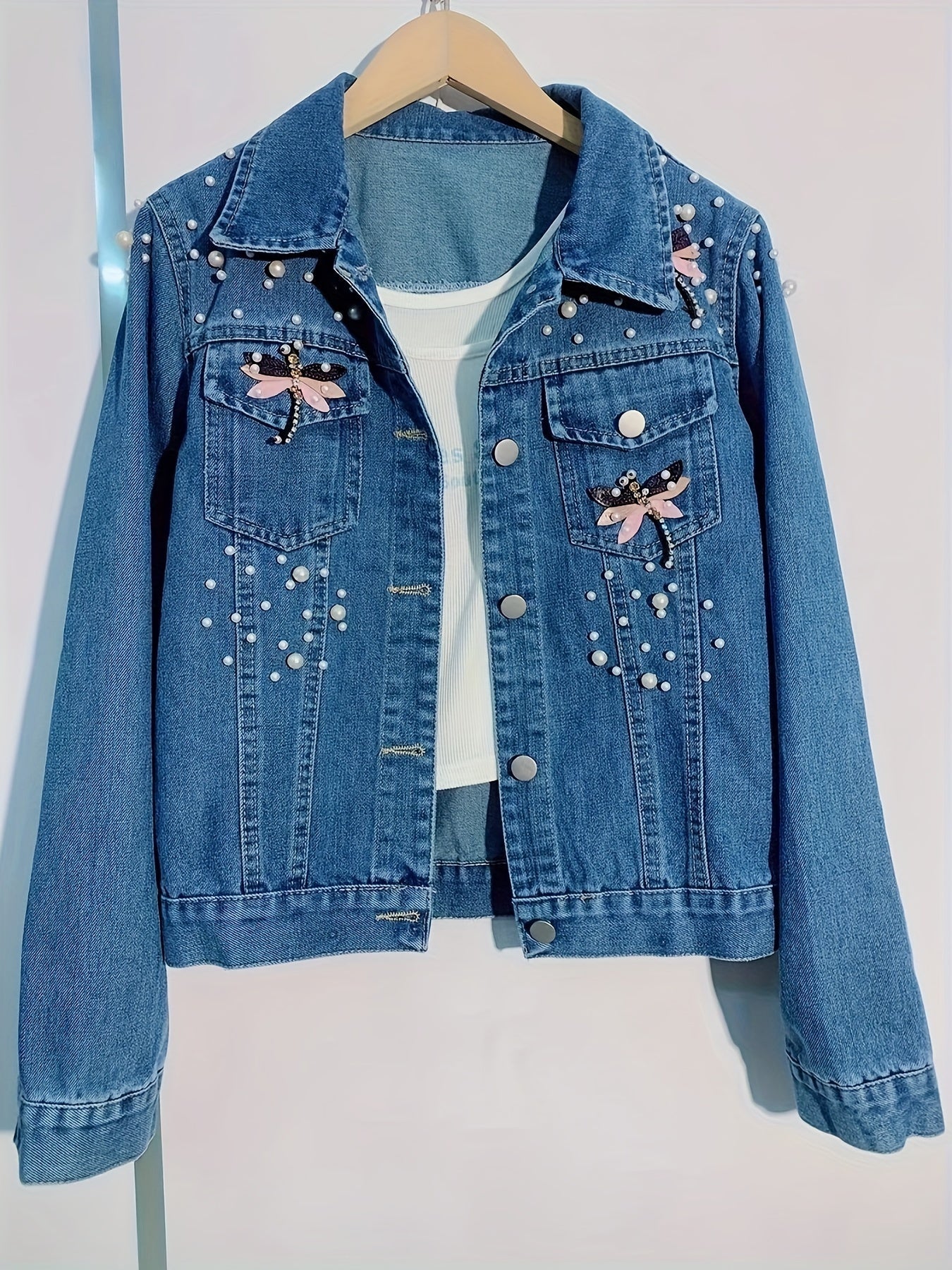 Women's denim jacket with blue pearl embellishments