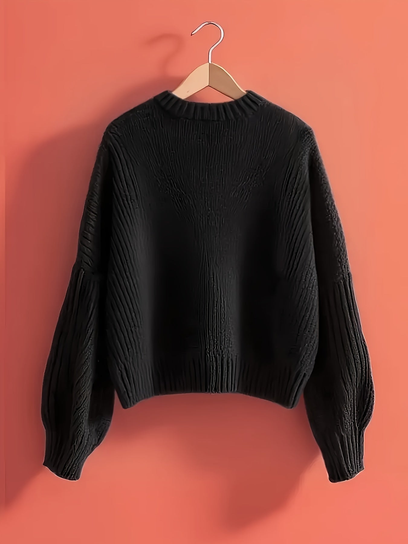 Women's ribbed long-sleeve V-neck sweater with a large bow