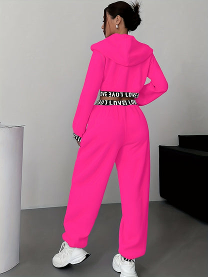 Women's two-piece tracksuit with a hooded jacket and cropped-length joggers featuring a “LOVE” waistband