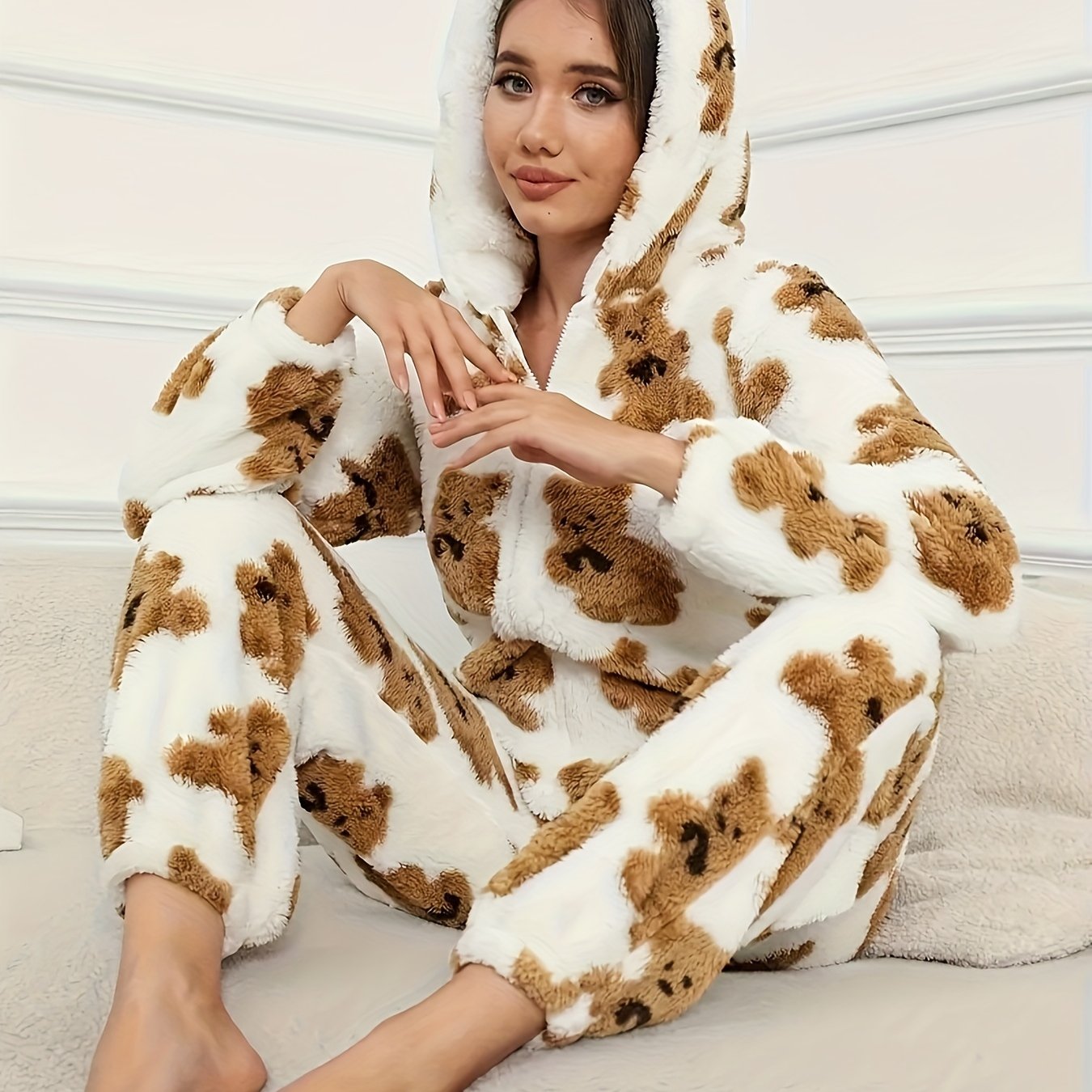 Women's fluffy sleep jumpsuit with zipper, hood, and bear pattern