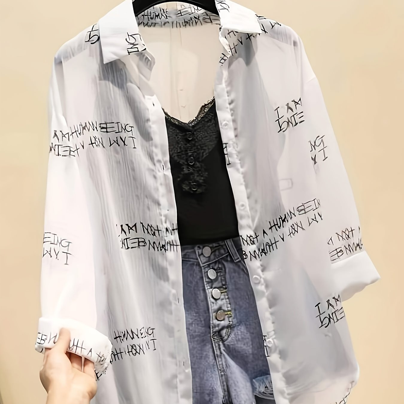 Women's blouse with newspaper print and shorts – fashionable set for leisure and everyday wear