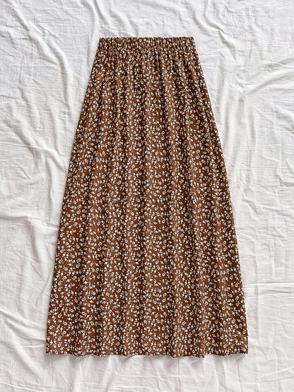 Women's midi skirt with floral pattern and slit – feminine A-line summer skirt for leisure & vacation