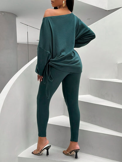 Women's dark green two-piece set with an off-shoulder top and leggings