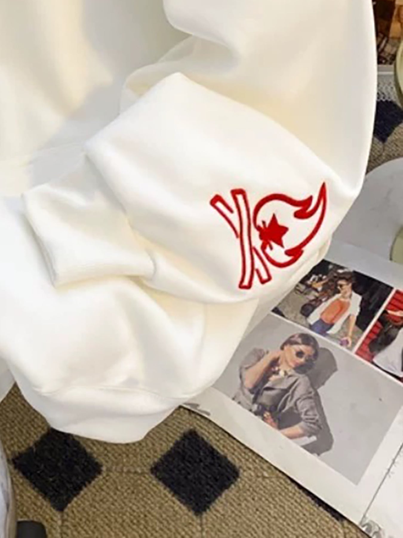 White hooded sweatshirt with red embroidery