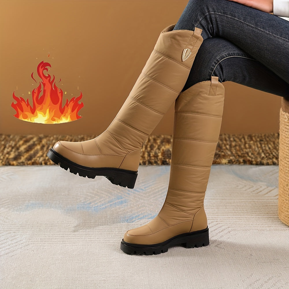 Women's knee-high padded winter boots with lug soles