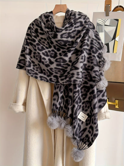 Leopard-print scarf with pom-poms