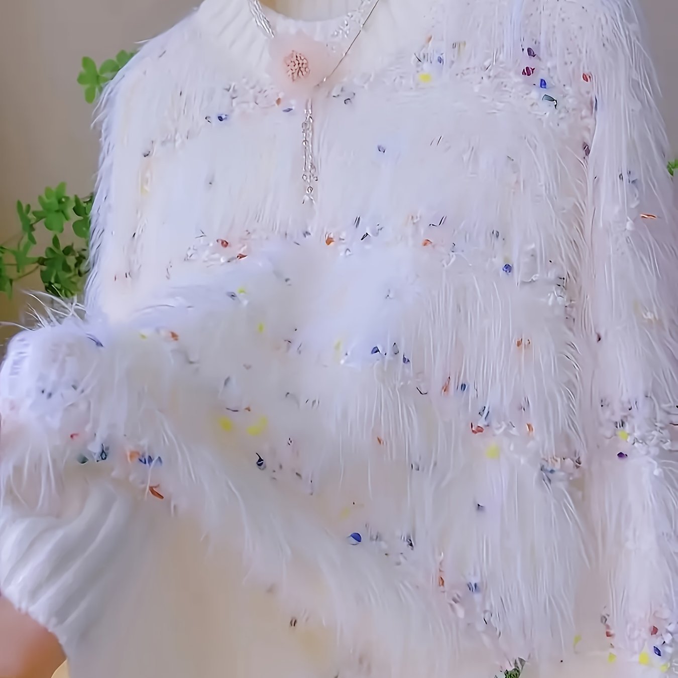 White fluffy pullover with colorful accents