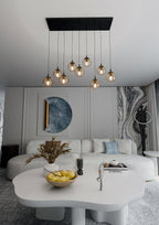 Hanglamp gepoedercoat staal en glas Cosmo, zwart met amber glazen kappen, 9 lichts, 104 x 120 cm, eettafel
