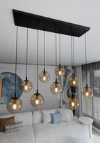 Hanglamp gepoedercoat staal en glas Cosmo, zwart met amber glazen kappen, 9 lichts, 104 x 120 cm, eettafel