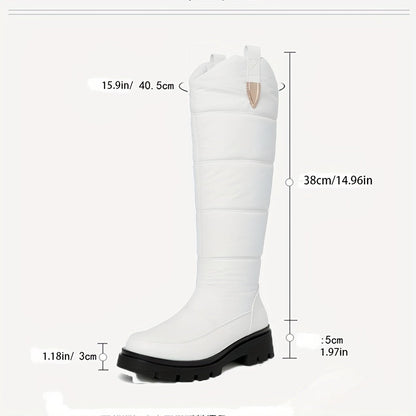 Women's knee-high padded winter boots with lug soles