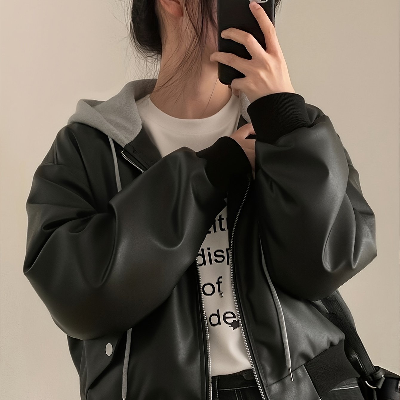 Unisex black bomber jacket with hood made of soft material