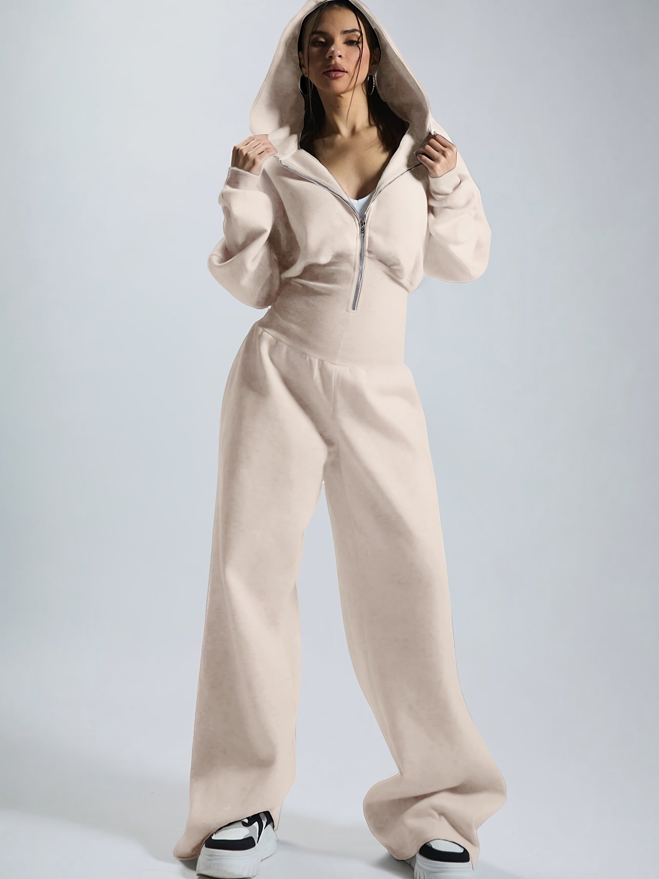 Women's jumpsuit with hood, long sleeves, wide legs, and zipper
