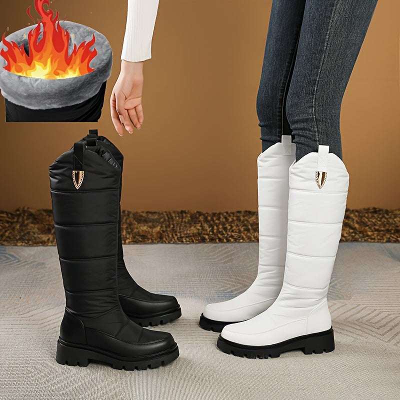 Women's knee-high padded winter boots with lug soles