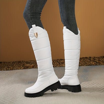 Women's knee-high padded winter boots with lug soles