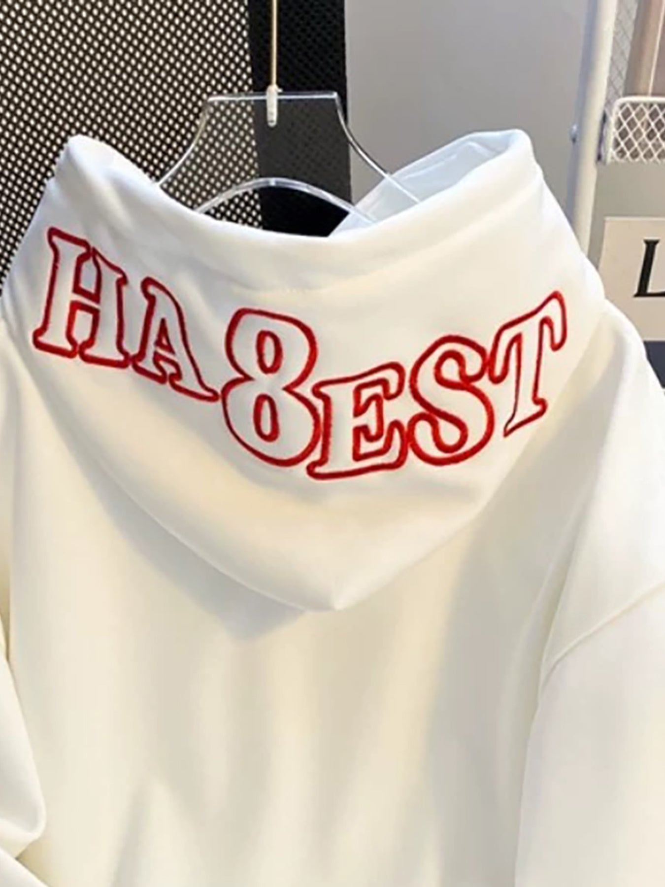 White hooded sweatshirt with red embroidery