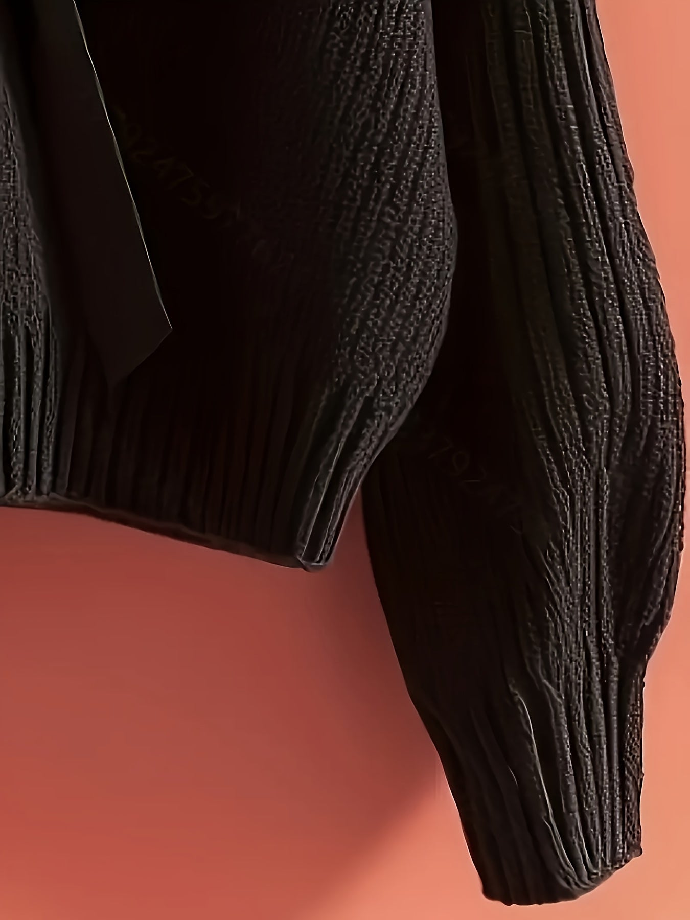 Women's ribbed long-sleeve V-neck sweater with a large bow