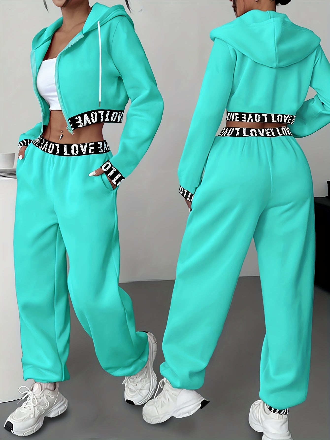 Women's two-piece tracksuit with a hooded jacket and cropped-length joggers featuring a “LOVE” waistband