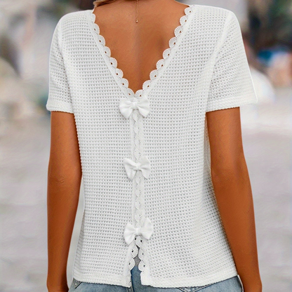 Women's short-sleeve top with lace back cutout and bow – feminine style for casual wear and summer
