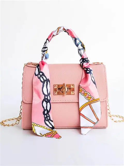 Elegant women's handbag with scarf handle and chain strap – fashionable accessory for everyday use and events