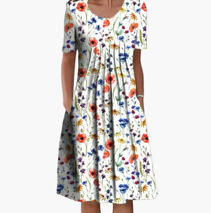 Women's summer dress with floral pattern – Loose mid-length dress with pockets, ideal for leisure and garden parties