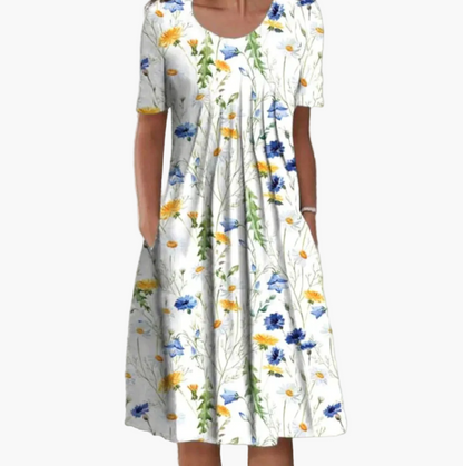 Women's summer dress with floral pattern – Loose mid-length dress with pockets, ideal for leisure and garden parties