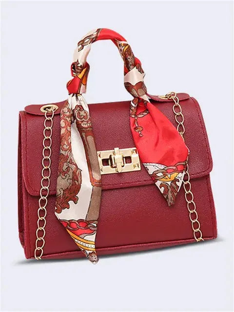 Elegant women's handbag with scarf handle and chain strap – fashionable accessory for everyday use and events