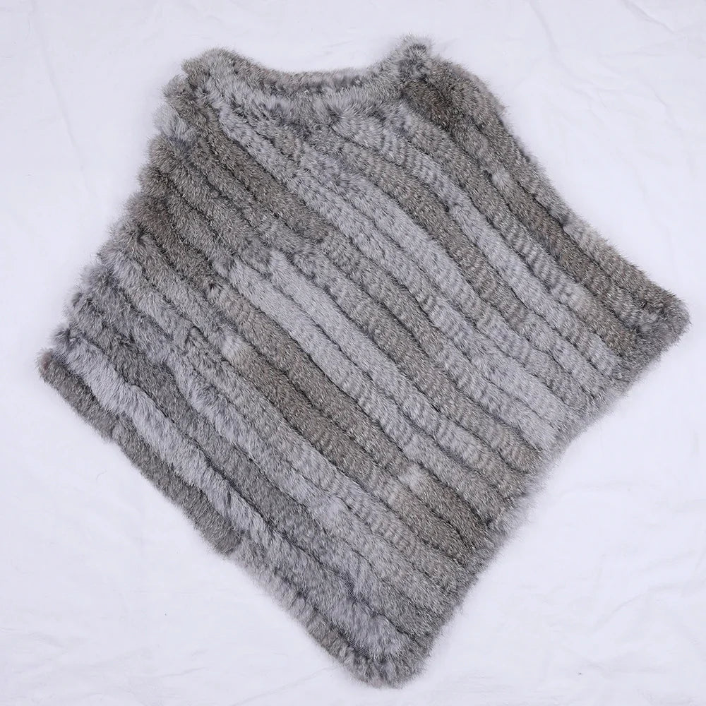 Soft faux-fur-look poncho with short sleeves, a round neckline, and an asymmetrical hem