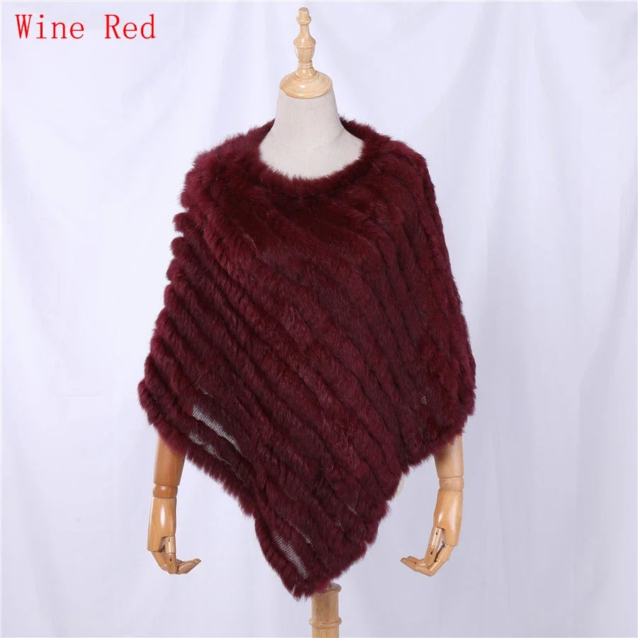 Soft faux-fur-look poncho with short sleeves, a round neckline, and an asymmetrical hem