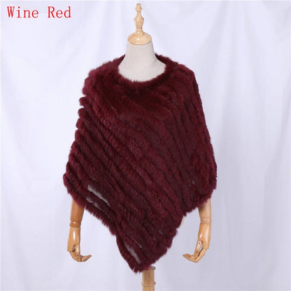Soft faux-fur-look poncho with short sleeves, a round neckline, and an asymmetrical hem