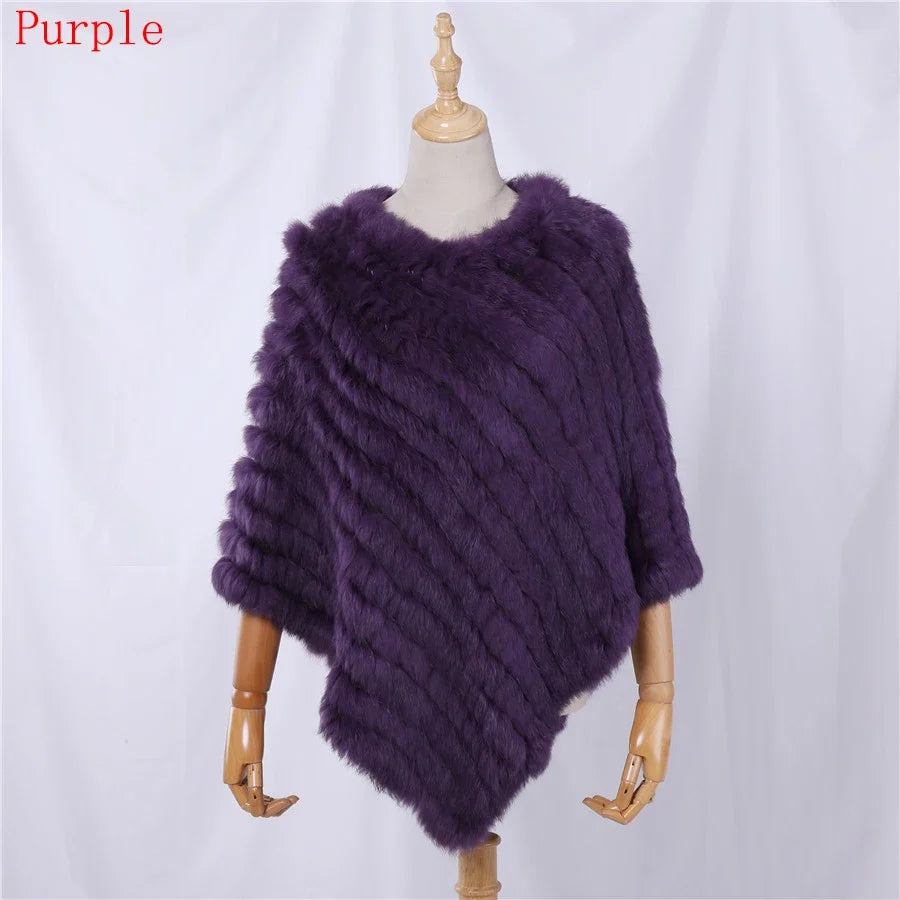 Soft faux-fur-look poncho with short sleeves, a round neckline, and an asymmetrical hem