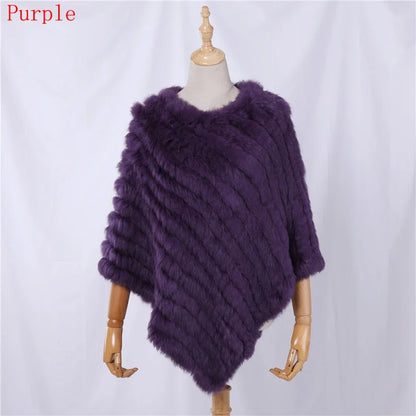 Soft faux-fur-look poncho with short sleeves, a round neckline, and an asymmetrical hem