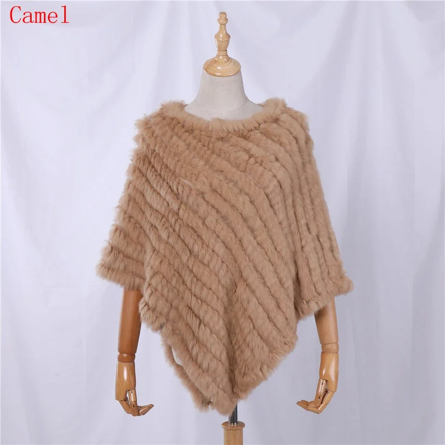Soft faux-fur-look poncho with short sleeves, a round neckline, and an asymmetrical hem