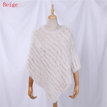 Soft faux-fur-look poncho with short sleeves, a round neckline, and an asymmetrical hem