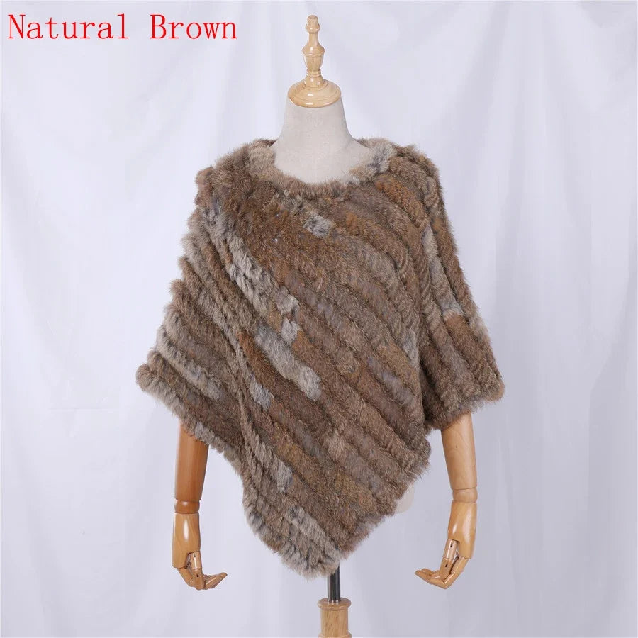 Soft faux-fur-look poncho with short sleeves, a round neckline, and an asymmetrical hem