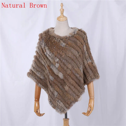 Soft faux-fur-look poncho with short sleeves, a round neckline, and an asymmetrical hem
