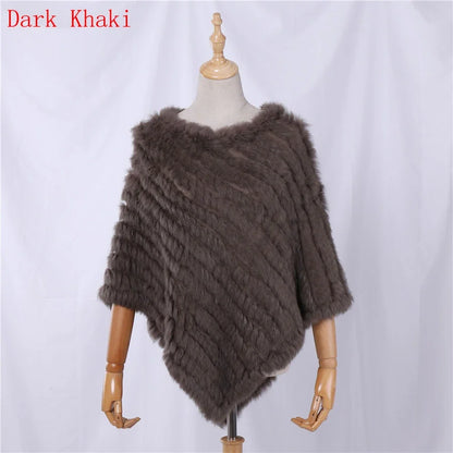 Soft faux-fur-look poncho with short sleeves, a round neckline, and an asymmetrical hem